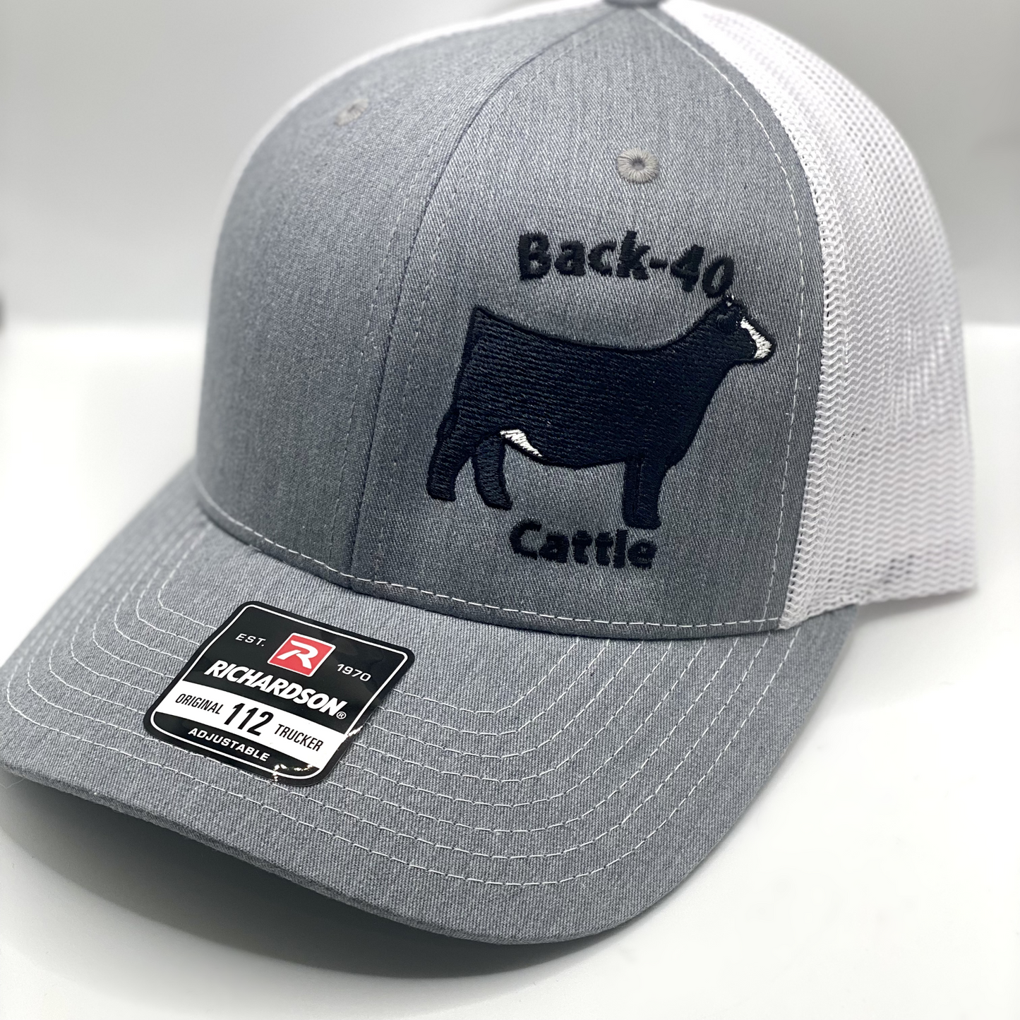 Custom embroidered livestock hat featuring detailed animal designs such as cattle, pigs, goats, and more. Available in various hat styles and colors, perfect for farmers, ranchers, and livestock enthusiasts. High-quality stitching ensures a durable and stylish look. Personalization options available for a unique touch.