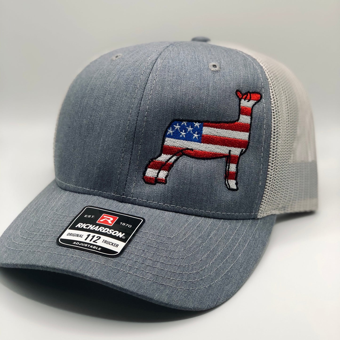 American Flag show sheep design embroidered on a Richardson 112 Trucker hat