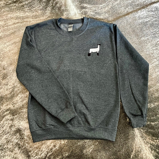 A cozy custom embroidered crewneck sweatshirt featuring detailed livestock designs, perfect for farmers, ranchers, and stock show enthusiasts. Made from soft, durable fabric for all-day comfort in the barn or at the fair.