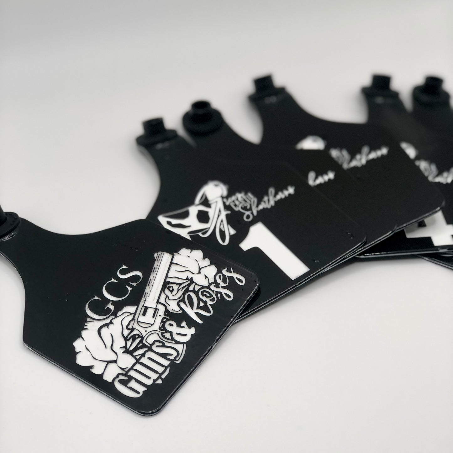 Custom laser-engraved cattle ear tag featuring durable Ritchey material with deep, long-lasting engraving. Includes Y-Tex button for secure attachment. Easy identification, weather resistance, and personalization with names, numbers, or ranch logos.