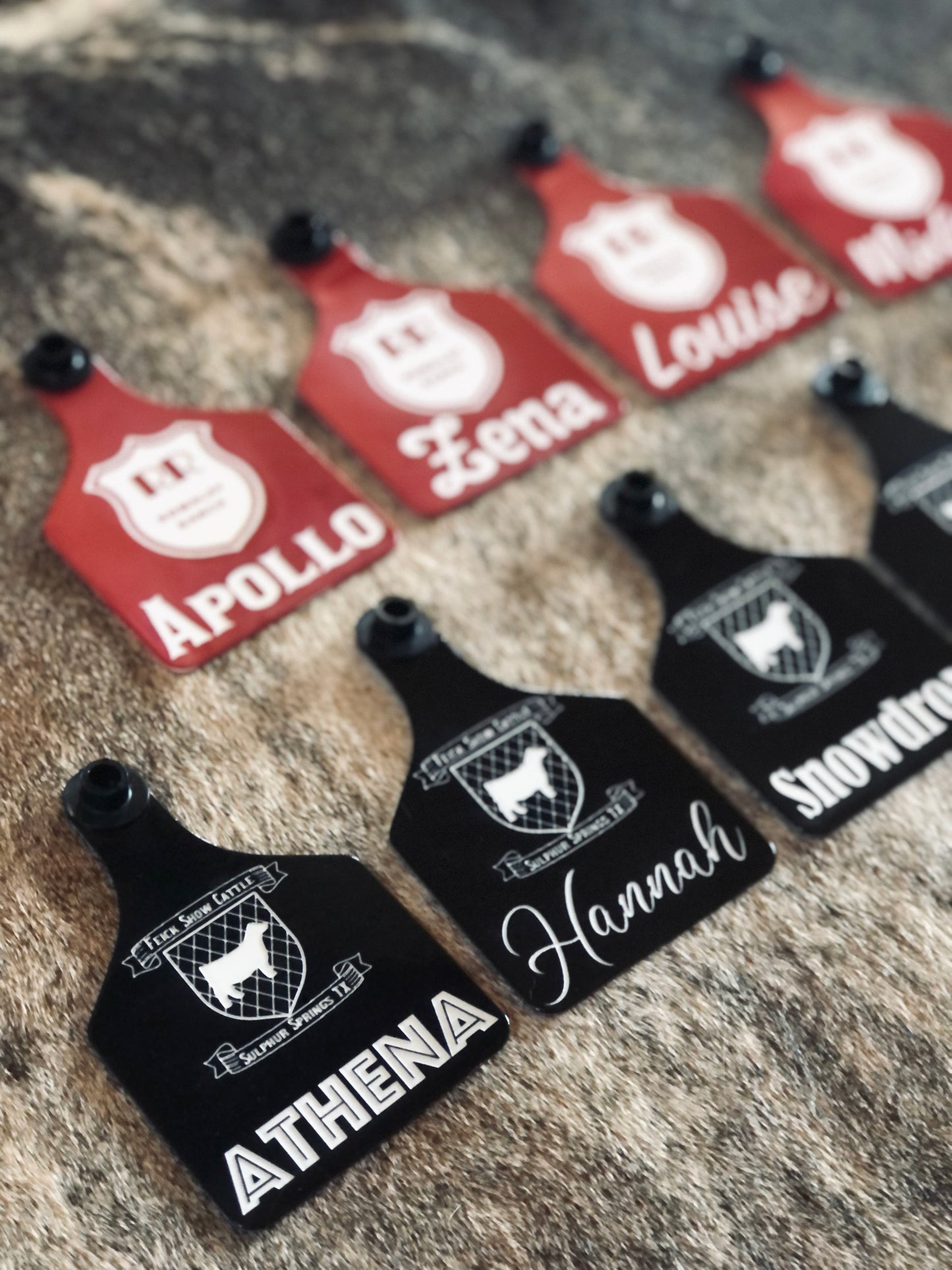 Custom laser-engraved cattle ear tag featuring durable Ritchey material with deep, long-lasting engraving. Includes Y-Tex button for secure attachment. Easy identification, weather resistance, and personalization with names, numbers, or ranch logos.