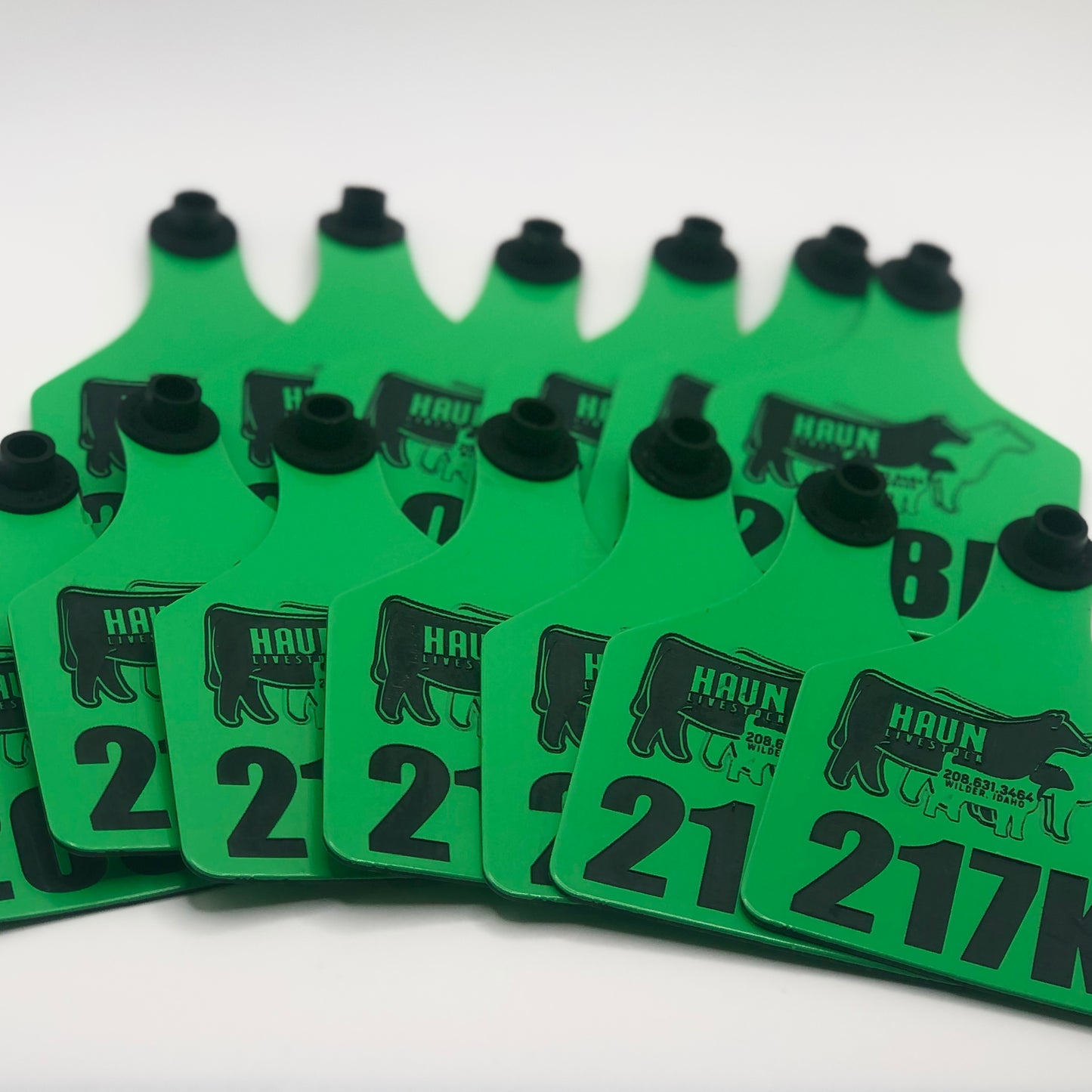 Custom laser-engraved cattle ear tag featuring durable Ritchey material with deep, long-lasting engraving. Includes Y-Tex button for secure attachment. Easy identification, weather resistance, and personalization with names, numbers, or ranch logos.