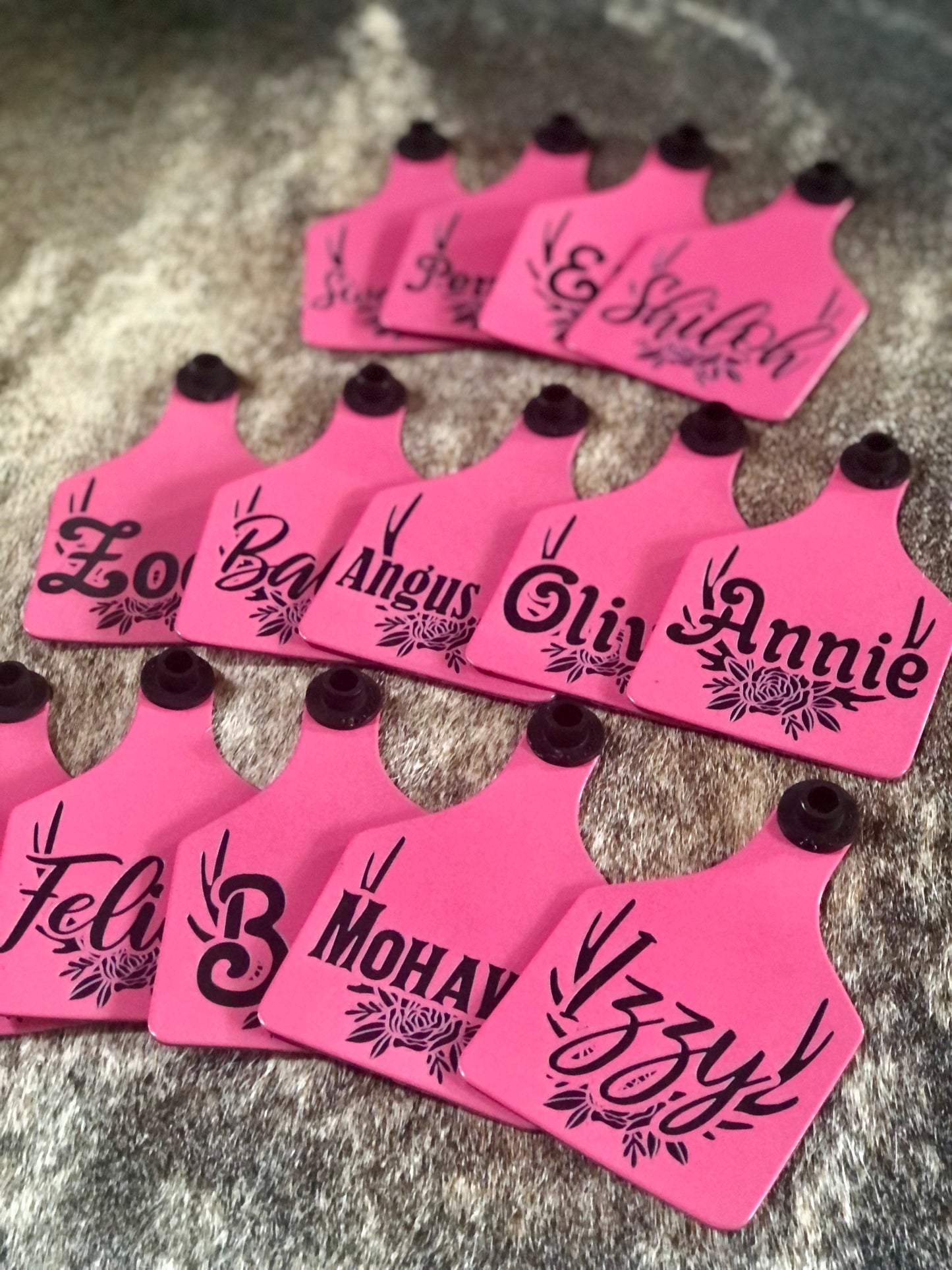 Custom laser-engraved cattle ear tag featuring durable Ritchey material with deep, long-lasting engraving. Includes Y-Tex button for secure attachment. Easy identification, weather resistance, and personalization with names, numbers, or ranch logos.