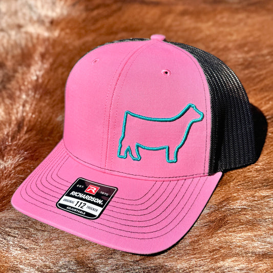 Pink cap with a raised 3D embroidered outline of a show heifer.