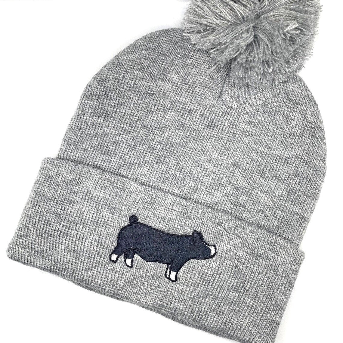 High quality custom embroidery of a Berkshire show pig on a comfy beanie hat.