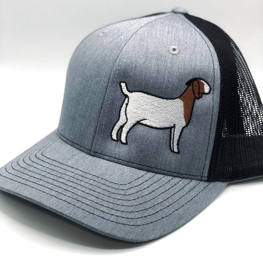 Embroidered goat design on a trucker hat with breathable mesh and an adjustable fit. Perfect for goat lovers, farmers, and showmen. A stylish, comfortable cap ideal for everyday wear or for showing off your goat pride at the barn.