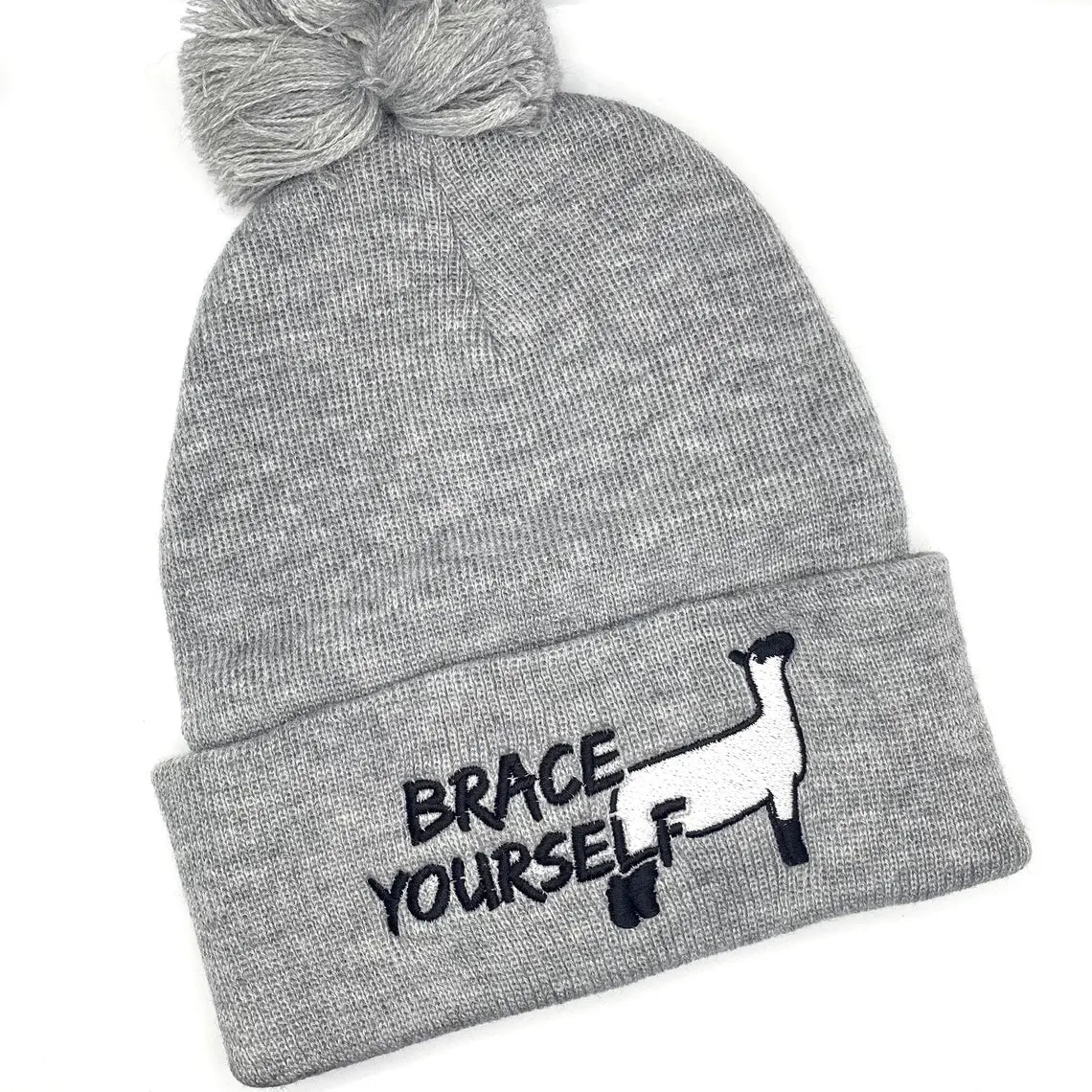Winter hat with show lamb embroidery that reads "Brace Yourself", a funny livestock pun.