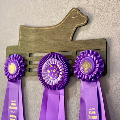 Custom engraved livestock show ribbon holder designed to display award ribbons. Personalized with name, show year, or farm name. Perfect for FFA, 4-H members, ranchers, and livestock exhibitors to showcase their achievements.