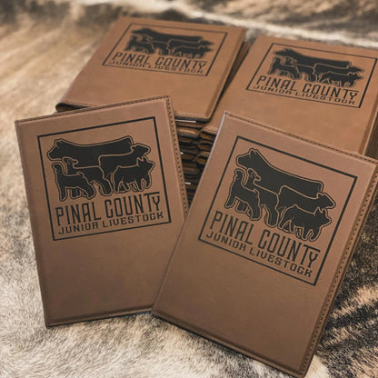 Custom engraved leatherette journal with a personalized design. Perfect for livestock judging, livestock show awards, ranchers, FFA, and 4-H members. Features a durable leatherette cover with lined pages for notes and organization.