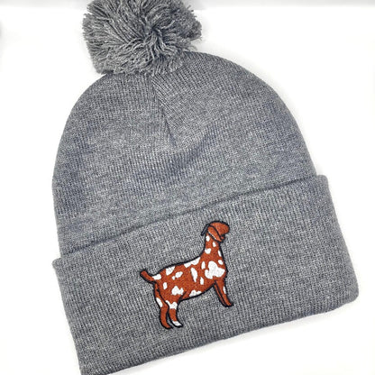 Winter hat featuring high quality embroidery of a spotted Boer show goat. 
