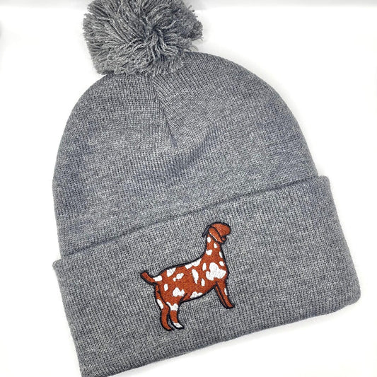 Winter hat featuring high quality embroidery of a spotted Boer show goat. 