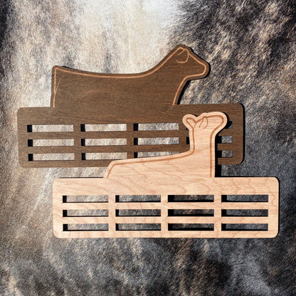 Custom engraved livestock show ribbon holder designed to display award ribbons. Personalized with name, show year, or farm name. Perfect for FFA, 4-H members, ranchers, and livestock exhibitors to showcase their achievements.
