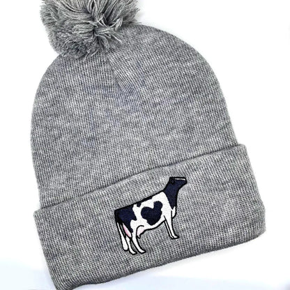 Comfy winter beanie hat featuring high quality embroidery of a Holstein dairy cow.
