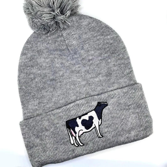 Comfy winter beanie hat featuring high quality embroidery of a Holstein dairy cow.