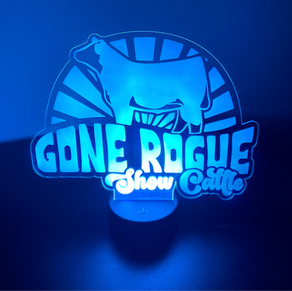 Custom LED light sign made from clear acrylic, personalized with text or design. The LED base is remote-controlled and can be powered by USB or batteries. Perfect for home decor or as a unique gift.