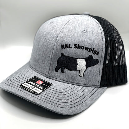 Custom embroidered pig design on a trucker cap with adjustable fit and breathable mesh. Ideal for pig buyers, breeders, and livestock enthusiasts, this personalized hat showcases farm pride and style.