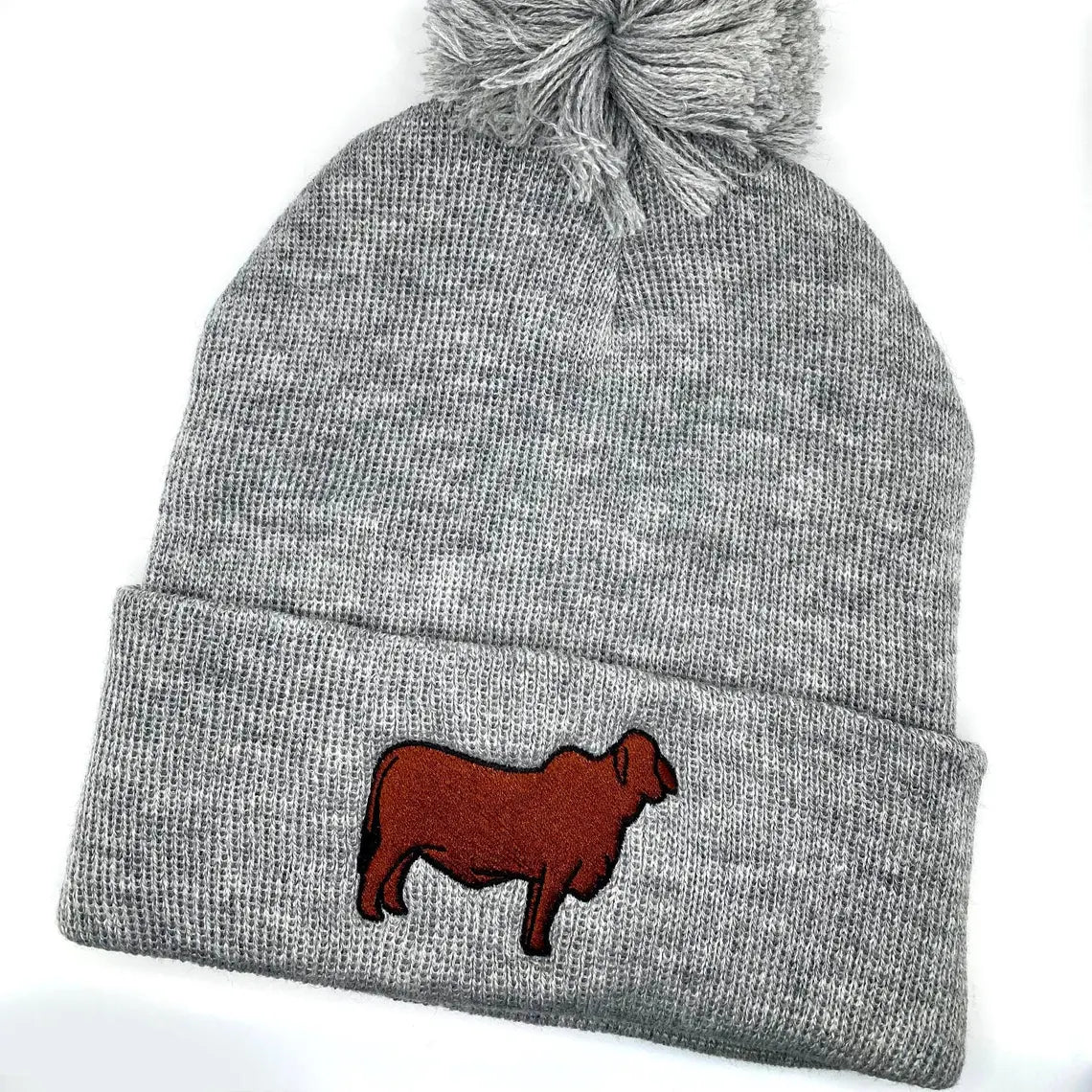 High quality embroidered beanie featuring a Brahman show heifer.