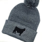Simmental cattle embroidered design on a cozy beanie, ideal for farmers, ranchers, and livestock enthusiasts.