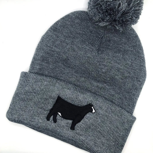 Simmental cattle embroidered design on a cozy beanie, ideal for farmers, ranchers, and livestock enthusiasts.