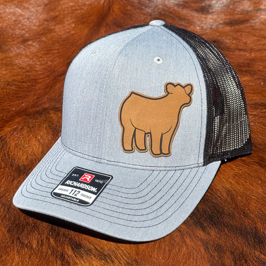 Heather grey and black Richardson 112 hat featuring a leather patch of a show steer.