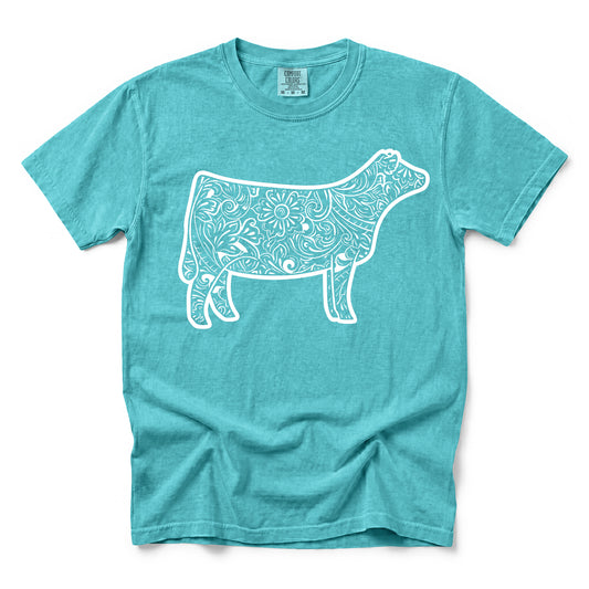 Turquoise Comfort Colors tee featuring a tooled leather design of a show heifer.