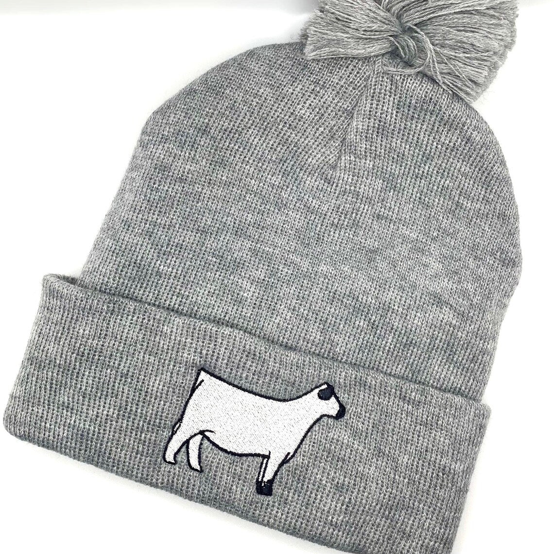 British White embroidered show heifer on a comfy winter beanie hat.