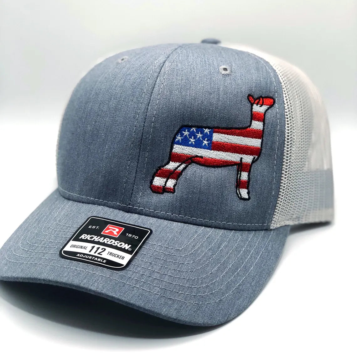 American Flag show sheep design embroidered on a Richardson 112 Trucker hat
