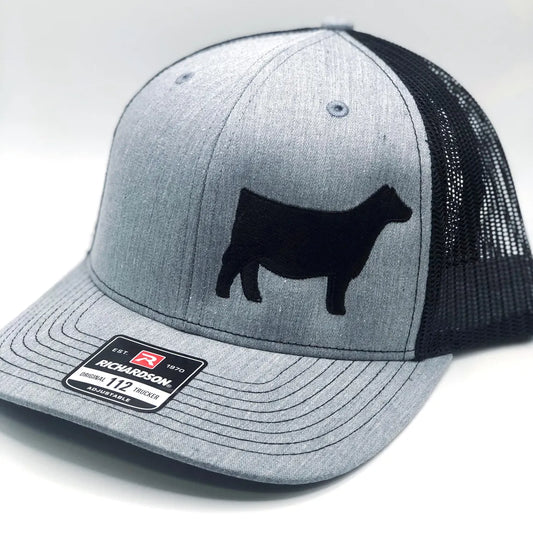 Embroidered Angus heifer hat featuring a detailed Angus cattle design on the front. Stylish and durable, perfect for livestock exhibitors, ranchers, and cattle enthusiasts. Adjustable fit for comfort and everyday wear.