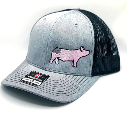 Richardson 112 hat featuring high quality embroidery of a blue butt show pig.