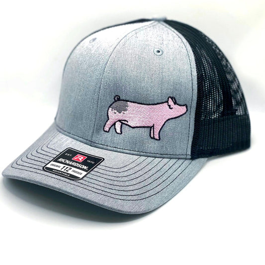 Richardson 112 hat featuring high quality embroidery of a blue butt show pig.