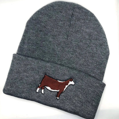 beanie with an embroidered Hereford heifer design, ideal for cattle breeders and showmen. This cozy hat keeps you warm during farm chores or show days. Perfect for showcasing your love for Hereford cattle and adding a fun touch to your wardrobe.
