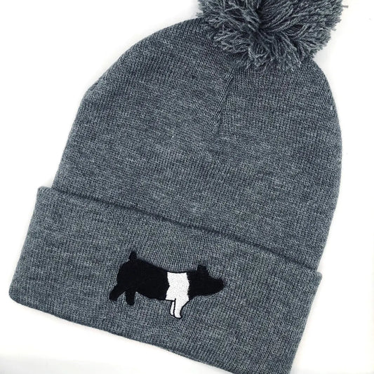 A custom embroidered beanie featuring a detailed design of a market hog. Made from high-quality materials, this hat offers warmth and comfort. It's available in various sizes, making it a perfect fit for livestock enthusiasts, especially those involved in pig shows or farming. The hat is ideal for casual wear or showcasing your love for livestock.