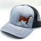 Embroidered Hereford trucker hat featuring a detailed cattle design. Breathable mesh back with an adjustable snapback closure for a comfortable fit. Perfect for ranchers, cattle show enthusiasts, and livestock lovers.