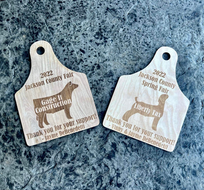 Custom engraved wooden plaque featuring a livestock buyer's name and event details, with an animal silhouette design. Made from white birch, it includes a pre-drilled hole for easy hanging. A thoughtful keepsake for county fair buyers, exhibitors, and livestock auction events.