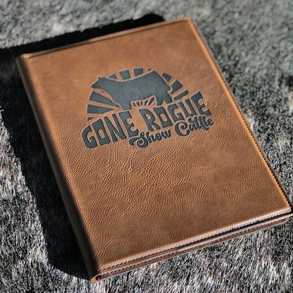 Custom engraved leatherette journal with a personalized design. Perfect for livestock judging, livestock show awards, ranchers, FFA, and 4-H members. Features a durable leatherette cover with lined pages for notes and organization.