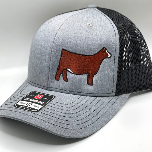 A stylish and adjustable cap featuring high-quality embroidery of a Simmental cow. Perfect for stock show enthusiasts, breeders, and farmers. Designed with breathable mesh and a comfortable fit for all-day wear.