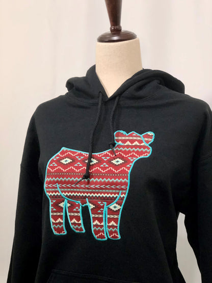 Embroidered show steer hoodie featuring a bold western-inspired design with an Aztec pattern. Made from soft, warm fabric, perfect for stock show exhibitors, ranchers, and cattle enthusiasts.