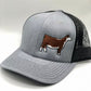 Embroidered Hereford trucker hat featuring a detailed cattle design. Breathable mesh back with an adjustable snapback closure for a comfortable fit. Perfect for ranchers, cattle show enthusiasts, and livestock lovers.
