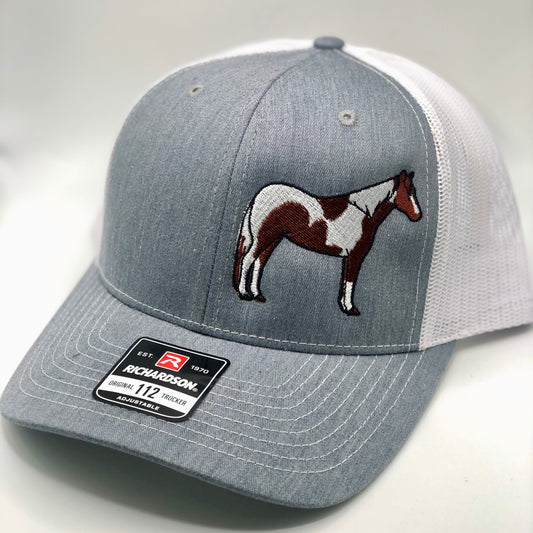 Paint Horse Embroidered Trucker Hat with detailed stitching on the front panel, featuring a breathable mesh back and adjustable snapback closure. Perfect for horse lovers, equestrians, and Western-style enthusiasts
